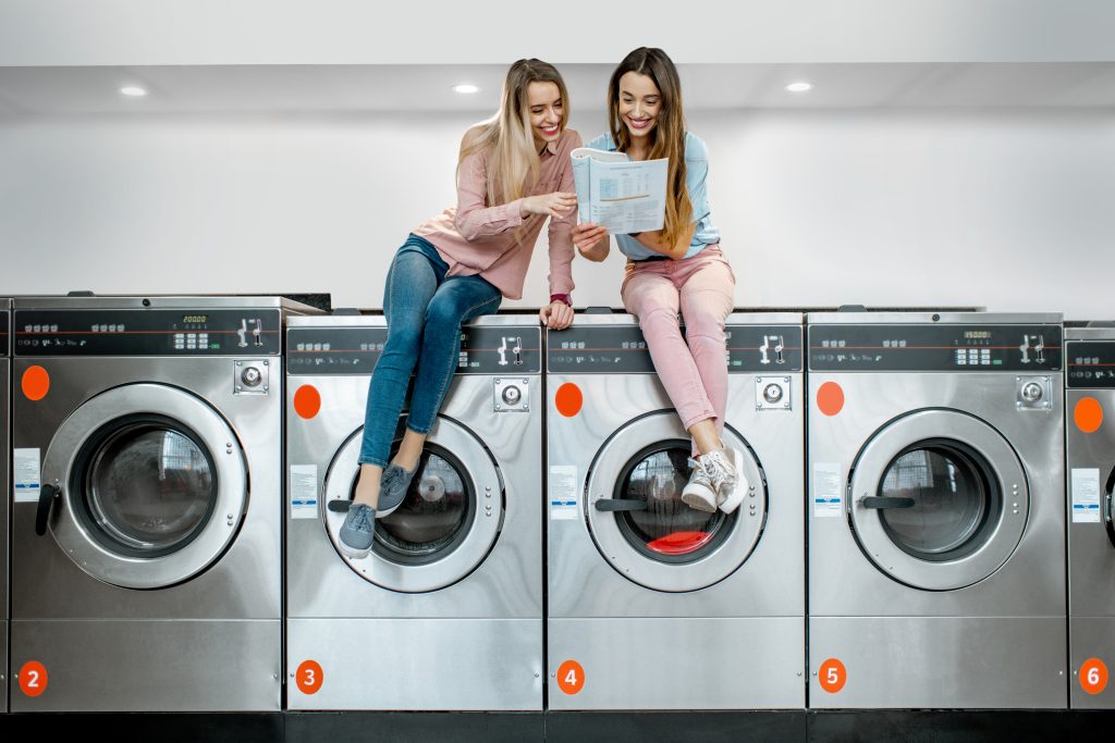 Women washing in the self-service laundry